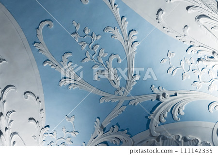 White bas-relief over blue ceiling background, wall design gypsum details White bas-relief over blue ceiling background, wall design gypsum details 111142335