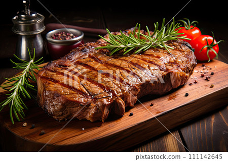 Grilled beef steak with rosemary and tomatoes 111142645