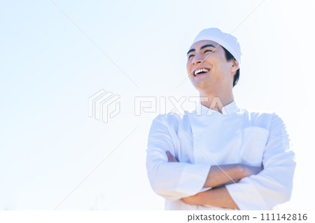 A young man working in a future-oriented food factory 111142816