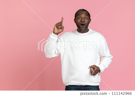 Excited black man wearing white sweatshirt raise finger having idea 111142966