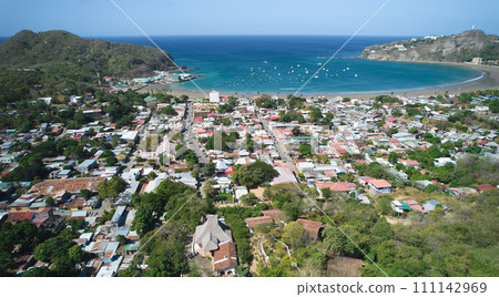 Small town next to ocean bay 111142969