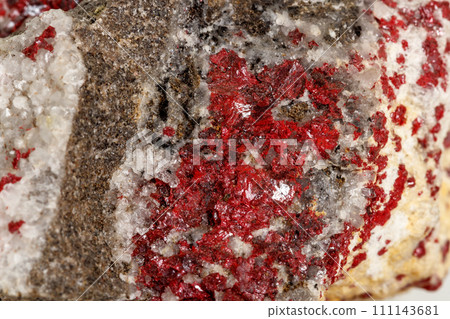 Macro stone mineral Cinnabar on a white background Macro stone mineral Cinnabar on a white background 111143681