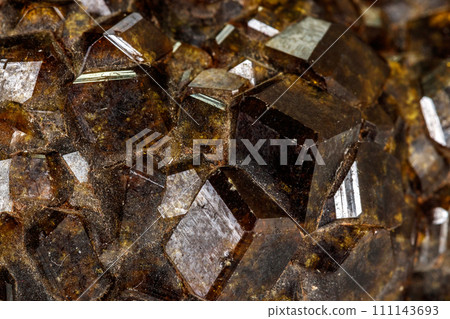 Macro stone Grossular mineral in rock on a white background 111143693