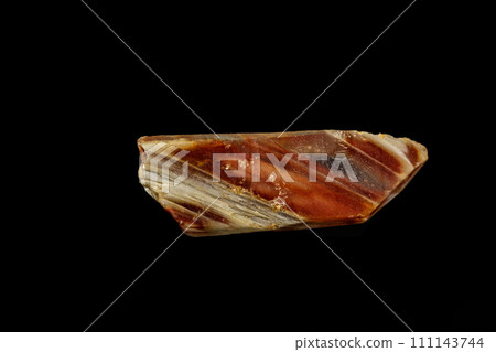 Macro of a mineral quartz stone with lepidokrokit on a black background 111143744