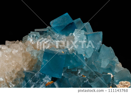 macro mineral fluorite stone on black background 111143768