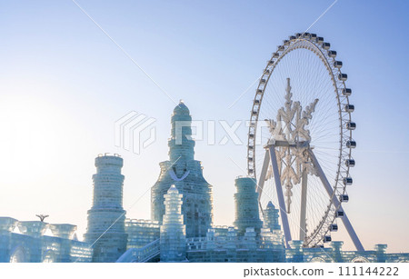 The giant snow ferris wheel in Harbin International Ice and Snow Sculpture Festival at Harbin, China. It is the world largest ice and snow festival. The giant snow ferris wheel in Harbin International Ice and Snow Sculpture Festival at Harbin, China. It is the world largest ice and snow festival. 111144222