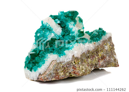 Macro mineral stone Dioptase silicate copper on a white background 111144262
