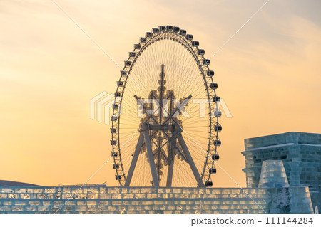 The giant snow ferris wheel in Harbin International Ice and Snow Sculpture Festival at Harbin, China. It is the world largest ice and snow festival. 111144284