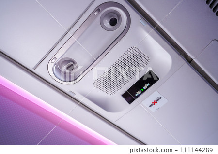 Commercial aircraft interior in airplane cabin, Overhead compartment Commercial aircraft interior in airplane cabin, Overhead compartment 111144289