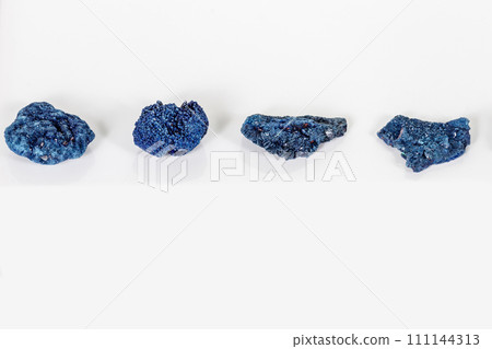 Macro mineral stone Malachite and Azurite against white background 111144313