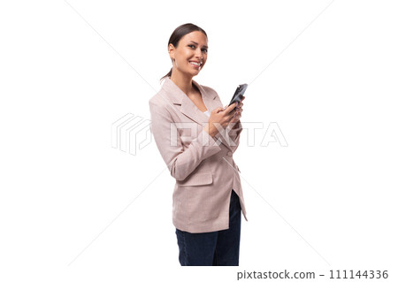 young confident caucasian woman with a ponytail hairstyle dressed in a jacket and jeans uses a young confident caucasian woman with a ponytail hairstyle dressed in a jacket and jeans uses a 111144336