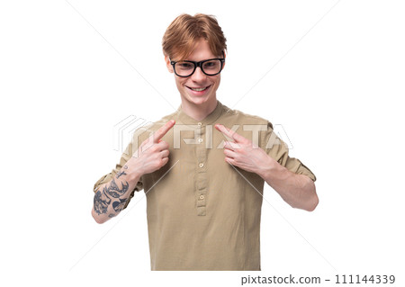 young charming caucasian guy with red hair in khaki shirt 111144339