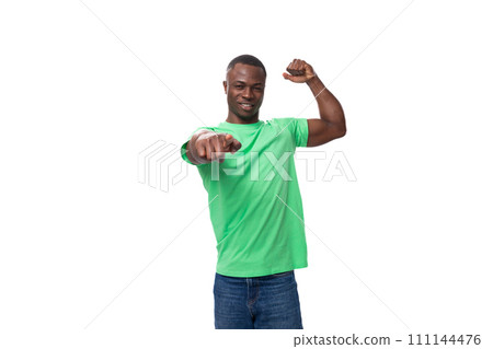 young charismatic american man in green t-shirt and jeans isolated on white background with copy young charismatic american man in green t-shirt and jeans isolated on white background with copy 111144476