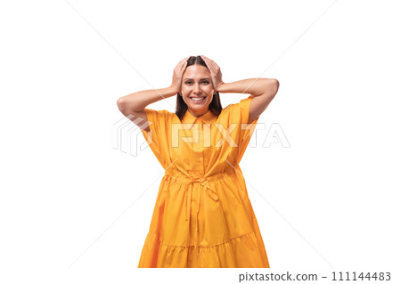 pretty young brunette lady dressed in a bright yellow dress on vacation pretty young brunette lady dressed in a bright yellow dress on vacation 111144483