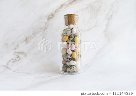 Easter decor for home. glass spice bottle full of chocolate eggs Easter decor for home. glass spice bottle full of chocolate eggs 111144559