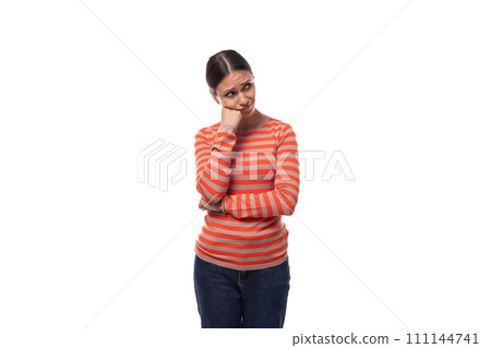 30 year old pretty woman dressed in a casual orange sweater is feeling sad and doubtful 30 year old pretty woman dressed in a casual orange sweater is feeling sad and doubtful 111144741