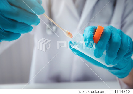 Doctor or medical staff is collecting secretions from patient for examination in the lab. Pandemic Coronavirus, COVID-19. Doctor or medical staff is collecting secretions from patient for examination in the lab. Pandemic Coronavirus, COVID-19. 111144840