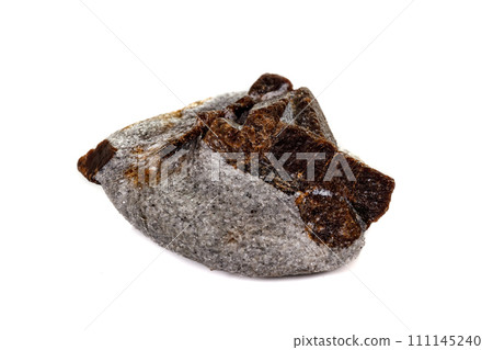 macro mineral stone Staurolite on a white background macro mineral stone Staurolite on a white background 111145240