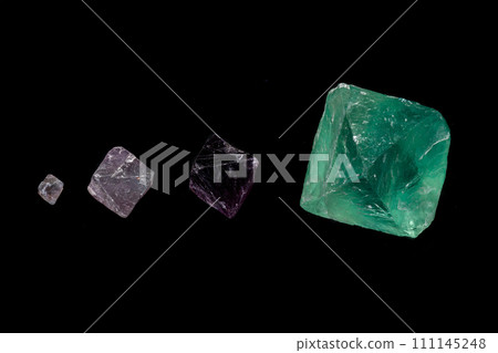 macro mineral fluorite stone on balck background 111145248