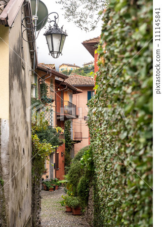 Enchanted alleyway in the scenic town of Bellagio at lake Como 111145841