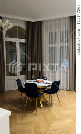 spacious living room with a small table for dinner spacious living room with a small table for dinner 111147263