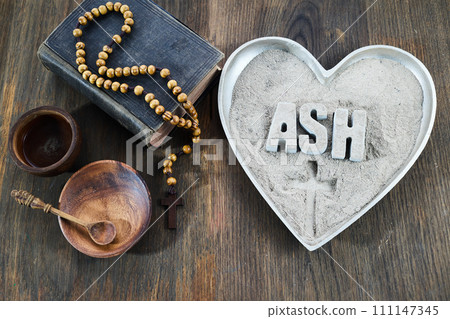 Ash wednesday, crucifix made of ash, dust as christian religion. Lent beginning 111147345