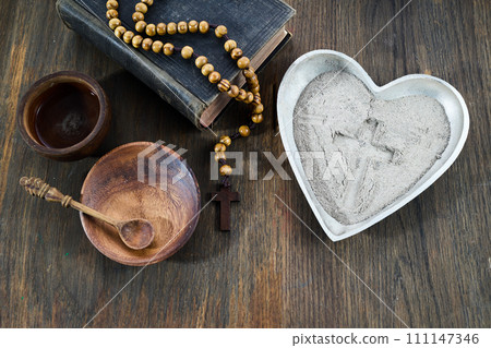 Ash wednesday, crucifix made of ash, dust as christian religion. Lent beginning 111147346