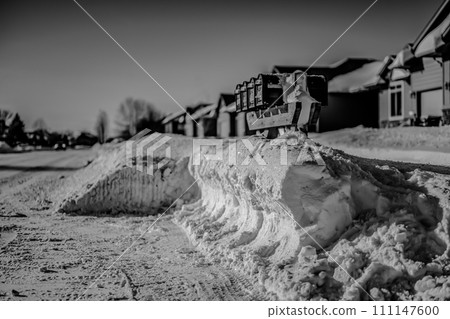 Snow pile removed from around a mailbox to assist in delivery  111147600