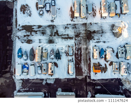 Drone view of camper, mobile home, and boat winter storage. Drone view of camper, mobile home, and boat winter storage. 111147624