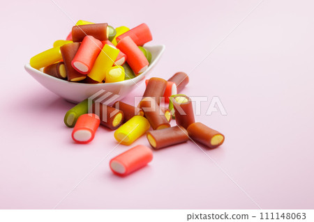 Colorful sweet jelly candies on pink background. 111148063