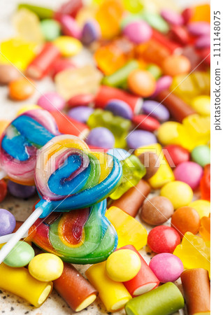Colorful sweet jelly candies and lollipops. Sweet candies. Colorful sweet jelly candies and lollipops. Sweet candies. 111148075