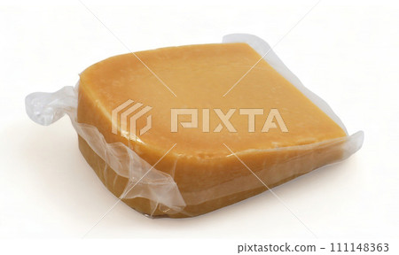 One parmesan cheese triangle in a transparent plastic wrap with soft shadows lies on a white background. Vacuum plastic bag with cheese. Mockup, packaging template with clipping path One parmesan cheese triangle in a transparent plastic wrap with soft shadows lies on a white background. Vacuum plastic bag with cheese. Mockup, packaging template with clipping path 111148363