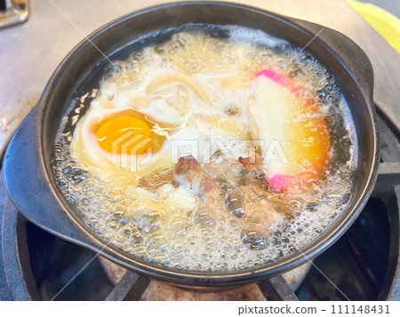 Nabeyaki udon being cooked 111148431