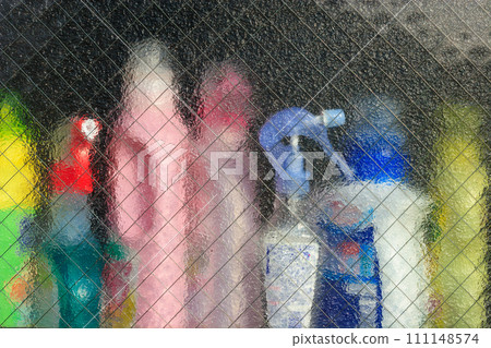Colorful detergent visible through the window 111148574