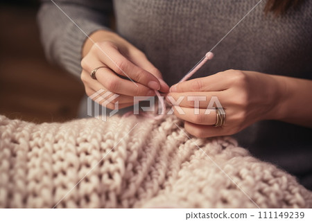 Close up view of woman's hands knitting woolen scarf. AI Generative 111149239