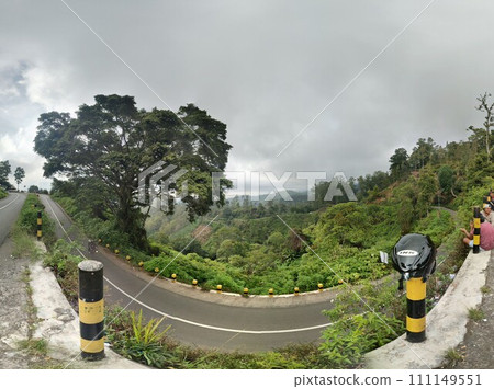The road is in the middle of forests and mountains which are cloudy and cool The road is in the middle of forests and mountains which are cloudy and cool 111149551