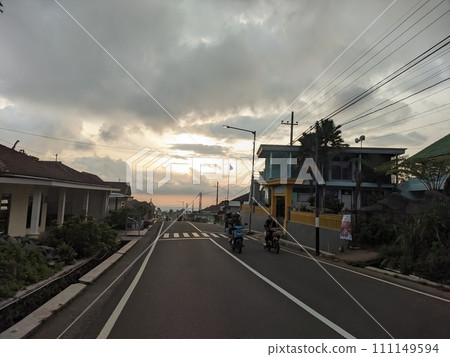 Twilight atmosphere on a beautiful village street in the afternoon Twilight atmosphere on a beautiful village street in the afternoon 111149594