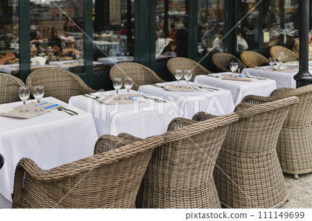 Traditional Parisian cafe with wicker chairs 111149699