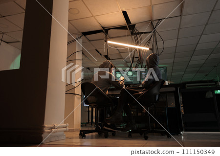 Cybercrime, hackers team coding internet virus program, hacking computer system, developers programming firewall. Criminals cracking password, developing malicious software Cybercrime, hackers team coding internet virus program, hacking computer system, developers programming firewall. Criminals cracking password, developing malicious software 111150349