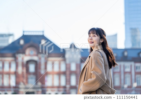 A middle-aged woman waiting for a meeting. 111150441