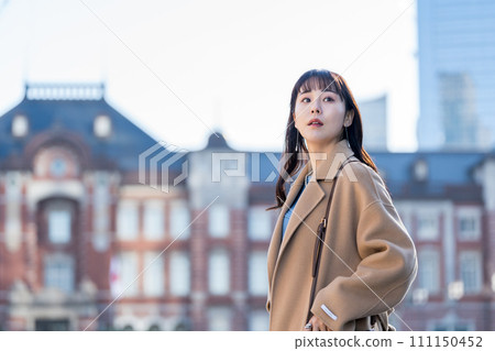 A middle-aged woman waiting for a meeting. 111150452