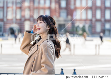 A middle-aged woman waiting for a meeting. 111150453