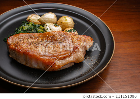 Pork saute, Garlic steak, spinach, overhead view 111151096