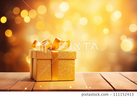Golden gift box with lights bokeh on wood background 111152413
