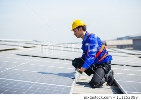 Technicians are installing and inspecting standards of solar panels on roof. Technicians are installing and inspecting standards of solar panels on roof. 111152889