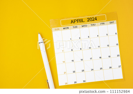 April 2024 Monthly calendar for 2024 year with pen on yellow. April 2024 Monthly calendar for 2024 year with pen on yellow. 111152984