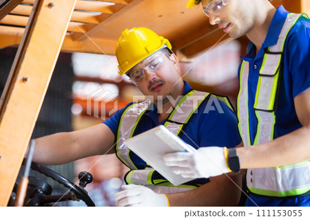 Worker wearing safety uniform drive forklift move product iron metal on shelves in warehouse. 111153055