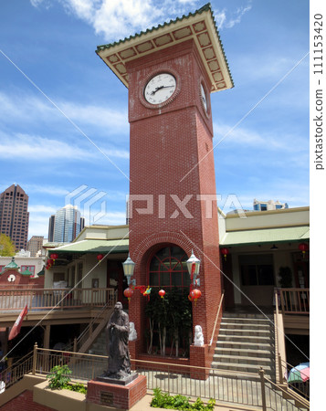 Historic Confucius statue below Chinese Clock tower in Maunakea Marketplace Chinatown 111153420