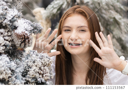 Portrait of face young caucasian beautiful woman blond hair smiling with braces. 111153567