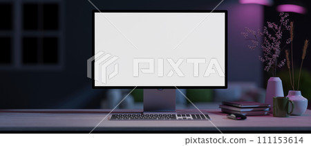 A modern home office with a white-screen computer mockup on a table with neon lights. 111153614